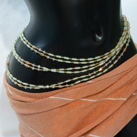 AfroBeads Waist Beads in Glow-In-the-Dark Light Peach, White and Gold Crystal  Tilted View