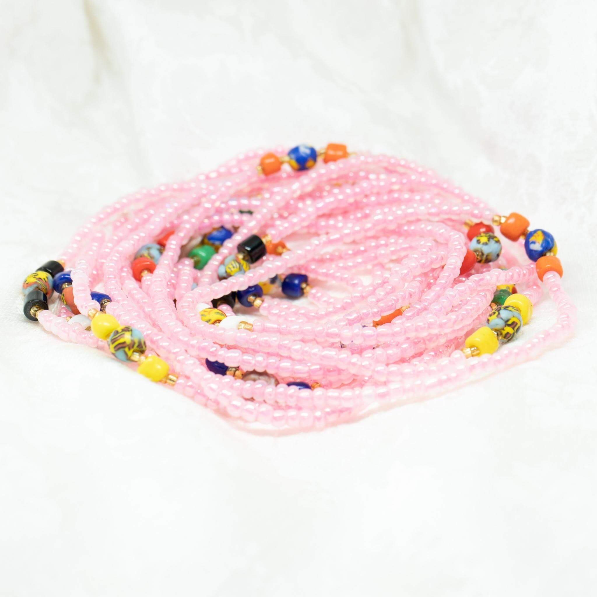 AfroBeads Waist Beads in Tribal Seeds with Charming Pink Strand