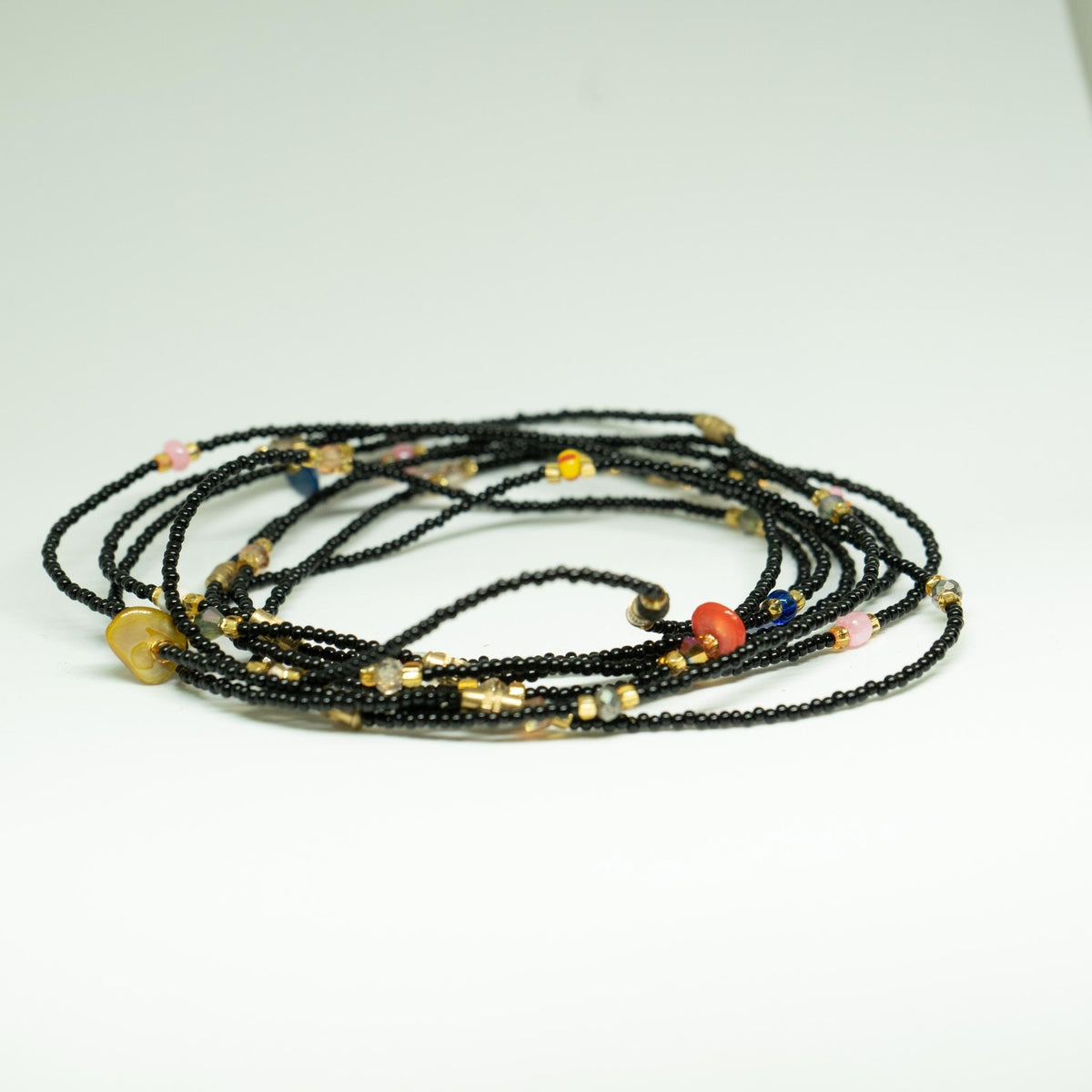 AfroBeads Anklets in Black Seeds, Fuchsia Pink with Marbled Seeds and.Orange Carnival