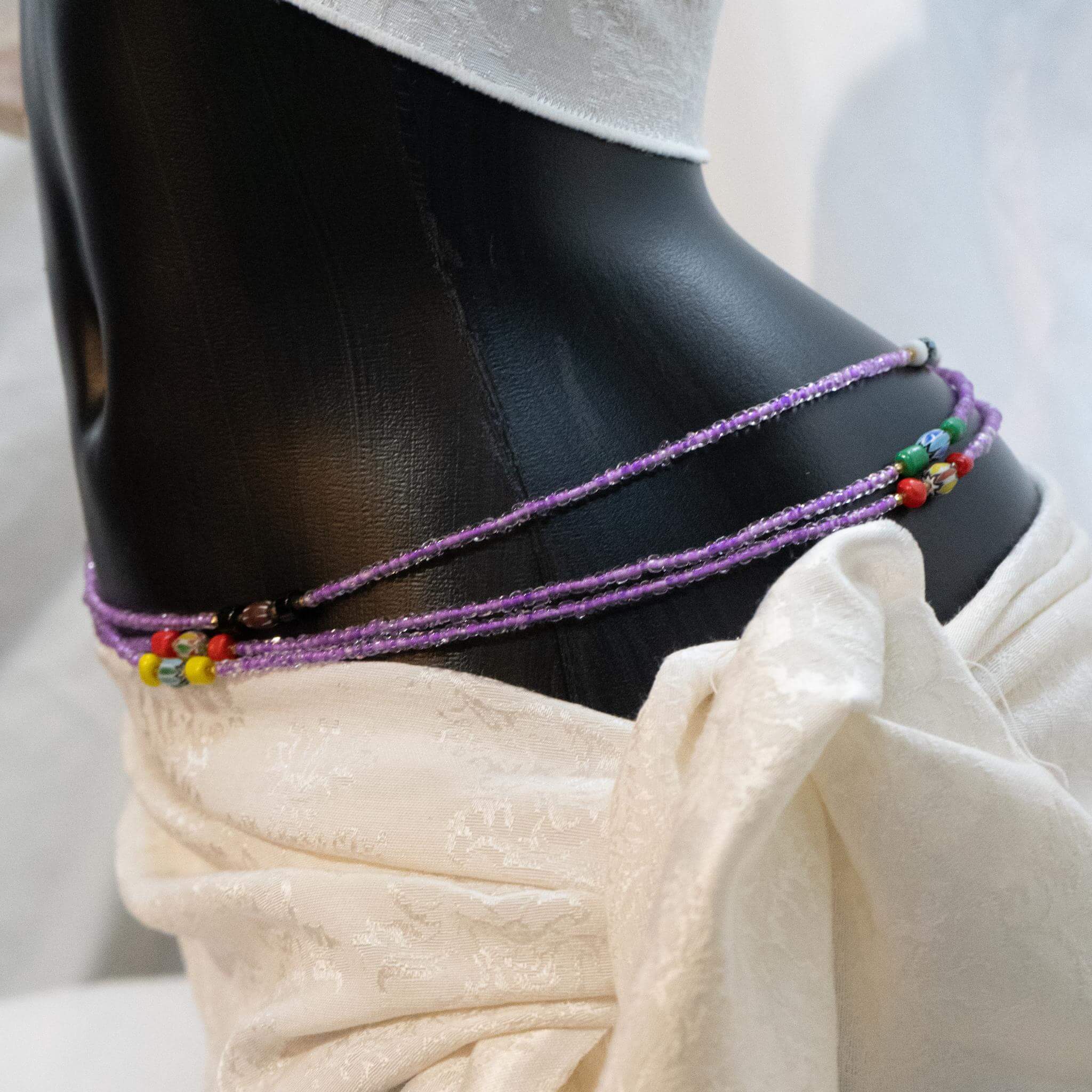 AfroBeads Waist Beads in Tribal Seeds with African Violet  Tilted View