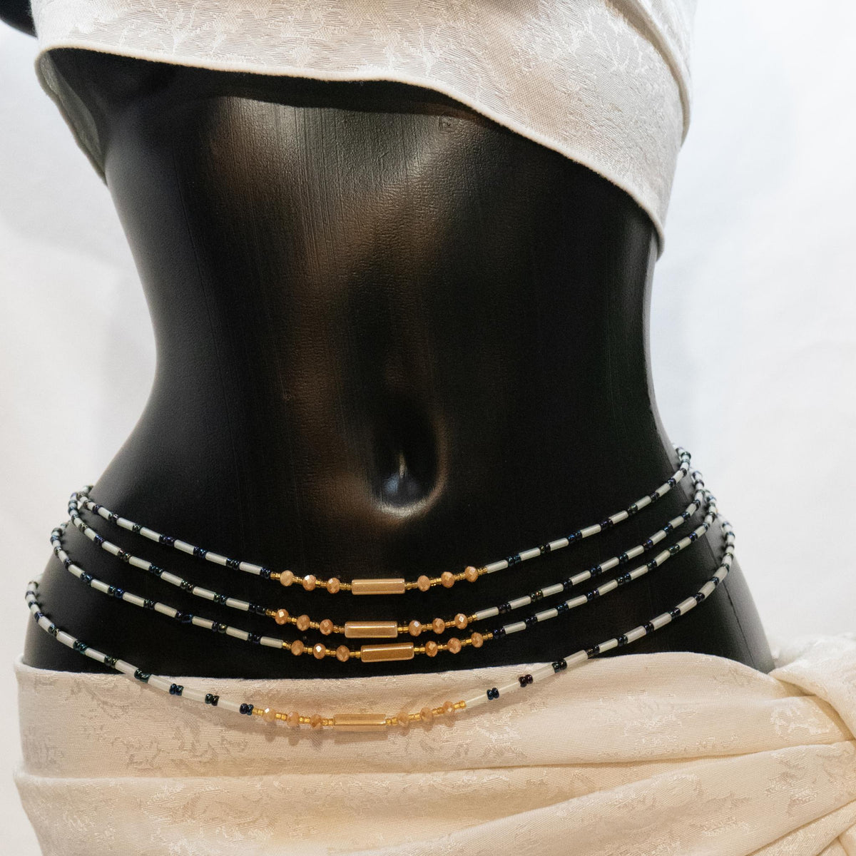 AfroBeads Waist Beads in Glow-In-the-Dark, Fawn, Sandy Brown, and Bermuda Blue 